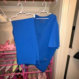 Women’s electric blue figs scrubs. Size large.